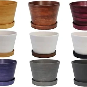 Nine ceramic planters with matching saucers in varied colors