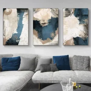 Three-panel abstract wall art on gray living room wall