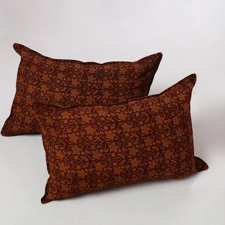 Rust damask pattern rectangular throw pillows on white background