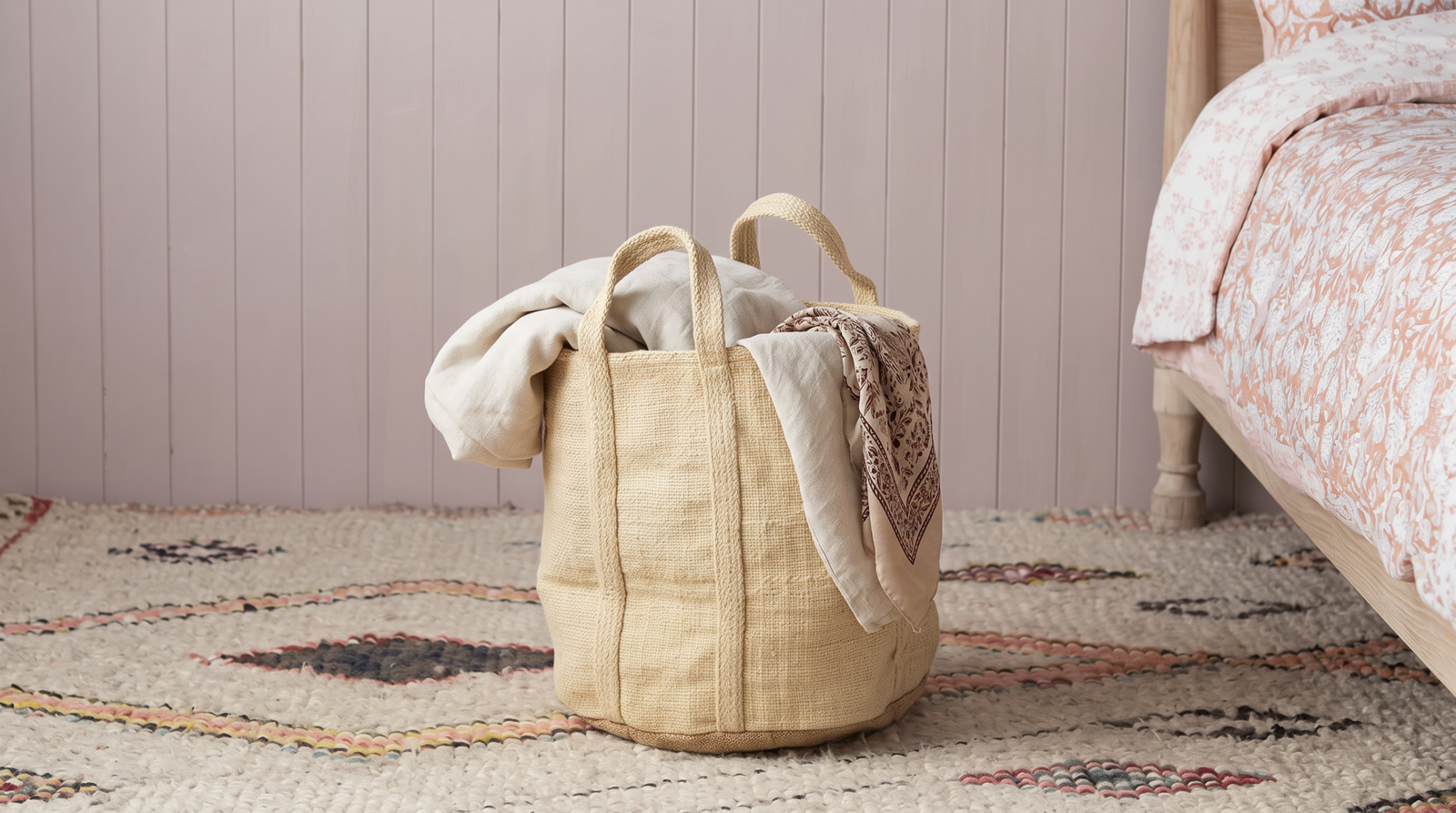 Jute storage basket handwoven with natural texture in bedroom setting